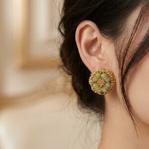 Vintage metal clip-on earrings with frosted green Murano glass beads